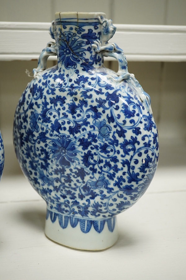 A pair of late 19th century Chinese blue and white moon vases, 23cm. Condition - one vase poor